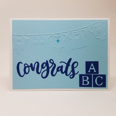 baby boy card - clothes and blocks